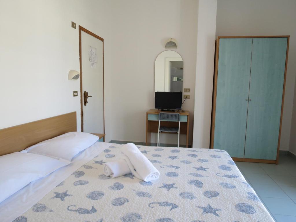Postel nebo postele na pokoji v ubytování Hotel Gemini