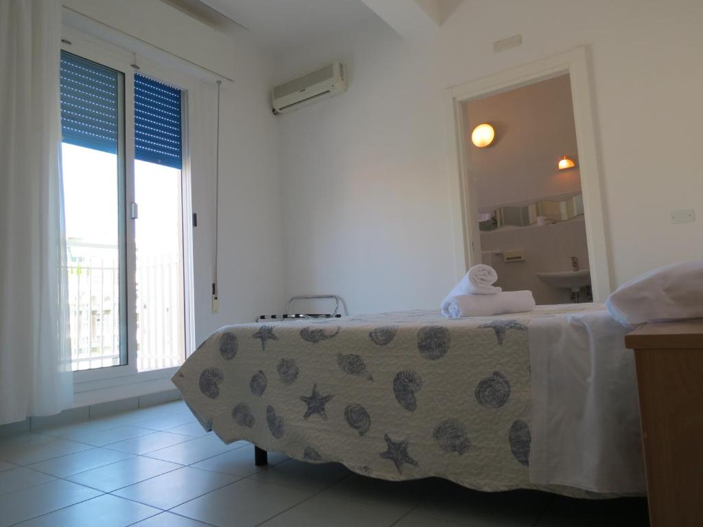 Postel nebo postele na pokoji v ubytování Hotel Gemini