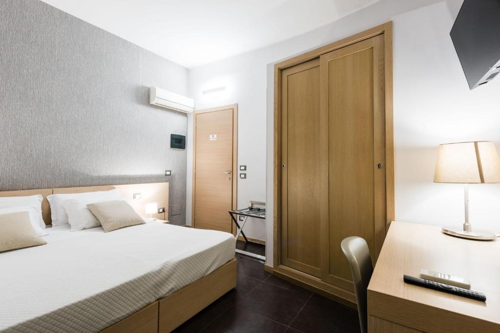 Postel nebo postele na pokoji v ubytování BeBIGEA Rooms