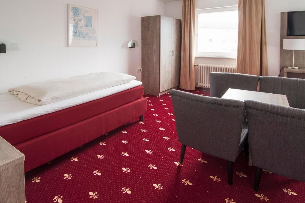 Postel nebo postele na pokoji v ubytování Hotel Maurer