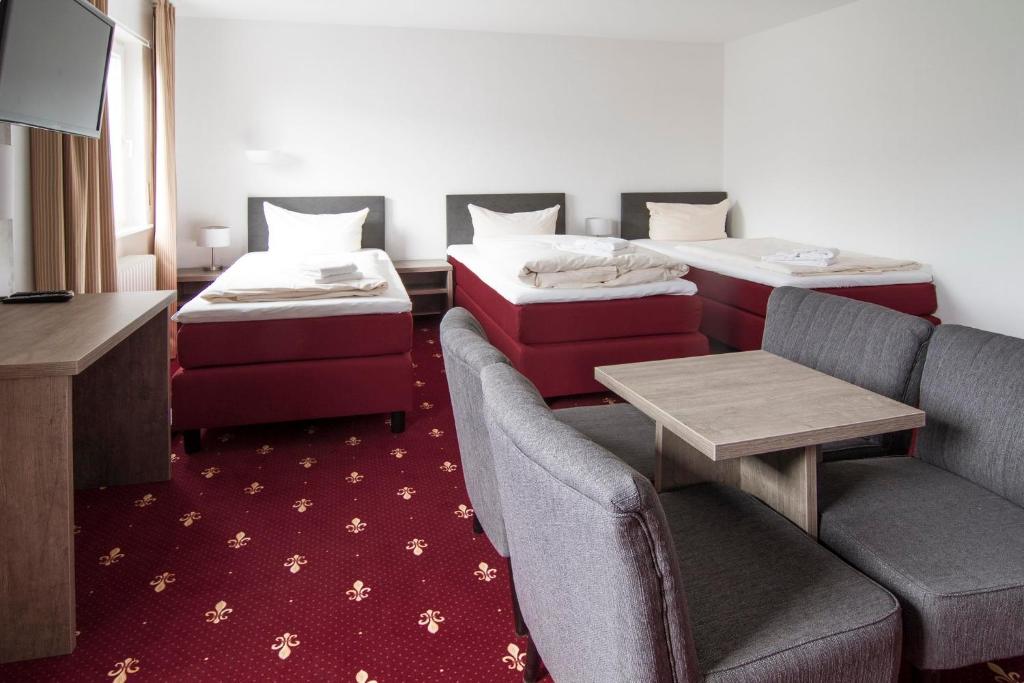 Postel nebo postele na pokoji v ubytování Hotel Maurer