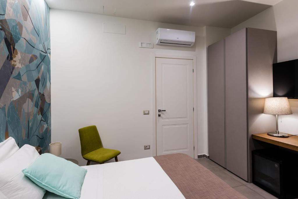 Postel nebo postele na pokoji v ubytování BeBIGEA Rooms
