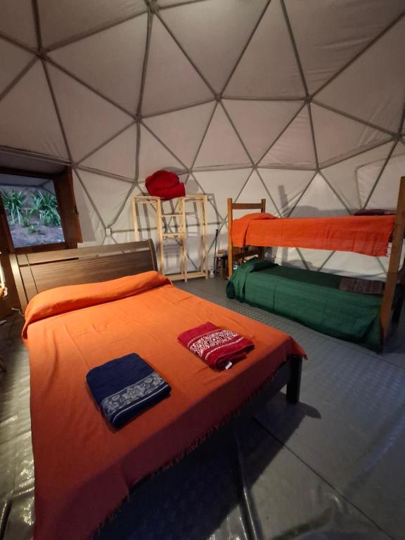 Voodi või voodid majutusasutuse Glamping Sitio das Tartarugas toas