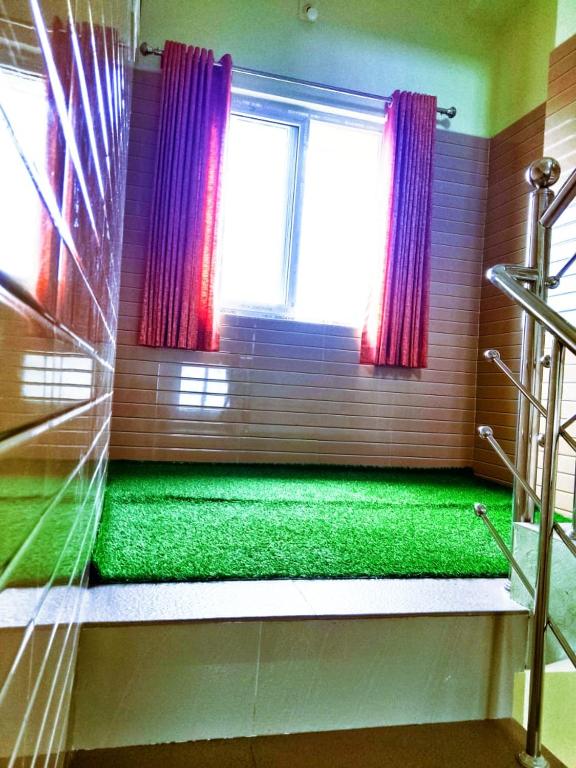 Postel nebo postele na pokoji v ubytování Elegant Homestay