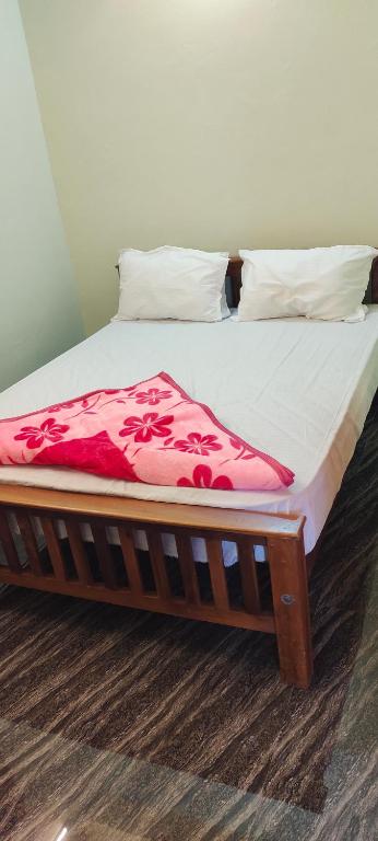 Postel nebo postele na pokoji v ubytování Elegant Homestay
