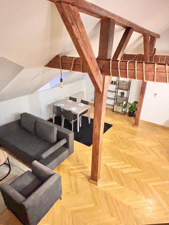 a living room with a couch and a table at Miru Loft Prague in Prague