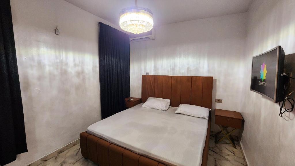 Postel nebo postele na pokoji v ubytování CG Apartments