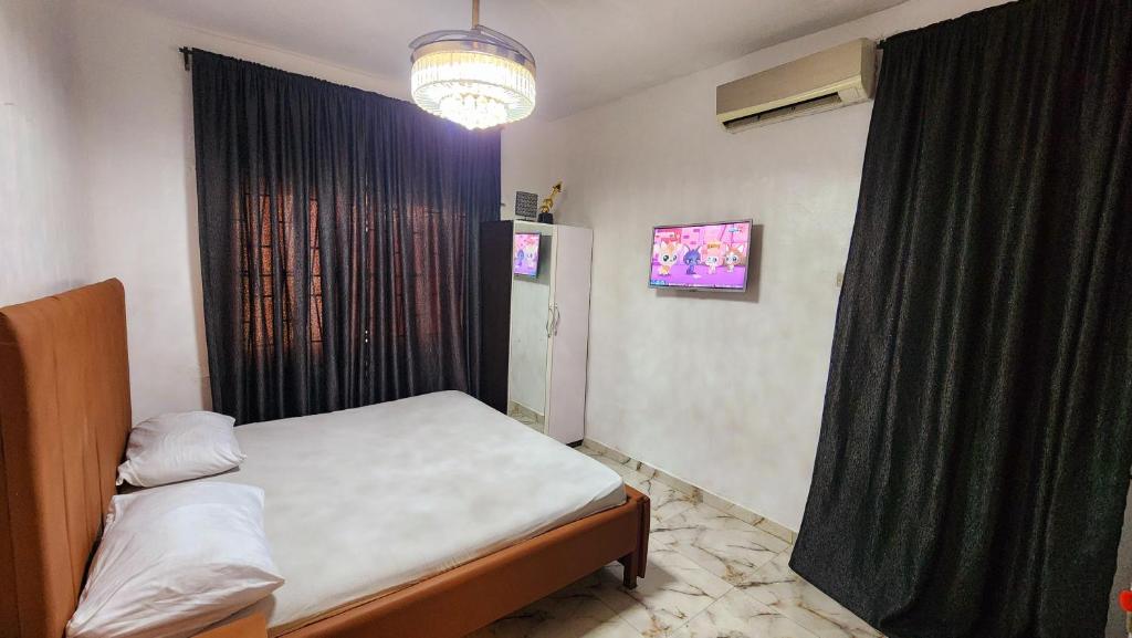 Postel nebo postele na pokoji v ubytování CG Apartments