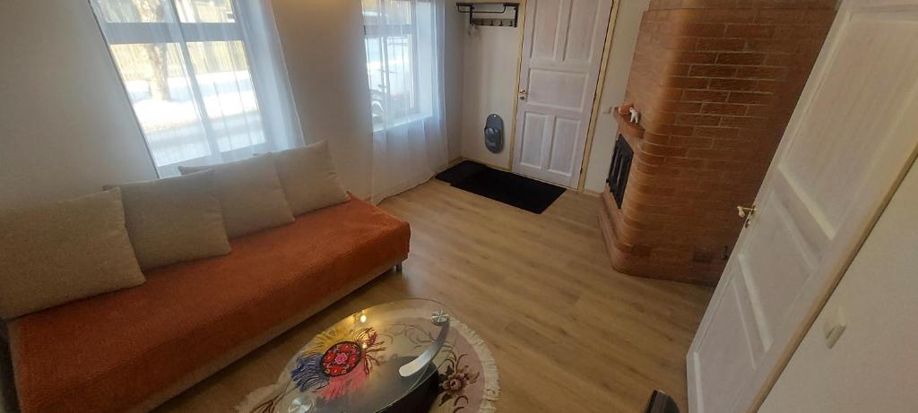 a living room with a couch and a table at Marja Apartment in Tartu