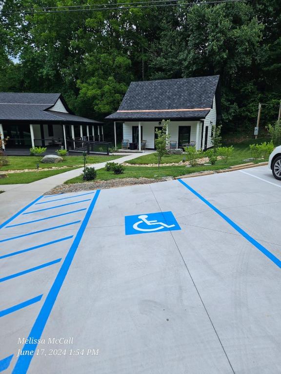 a parking lot with a handicapped sign in front of a house at Life's Especially Good Retreat in Brevard