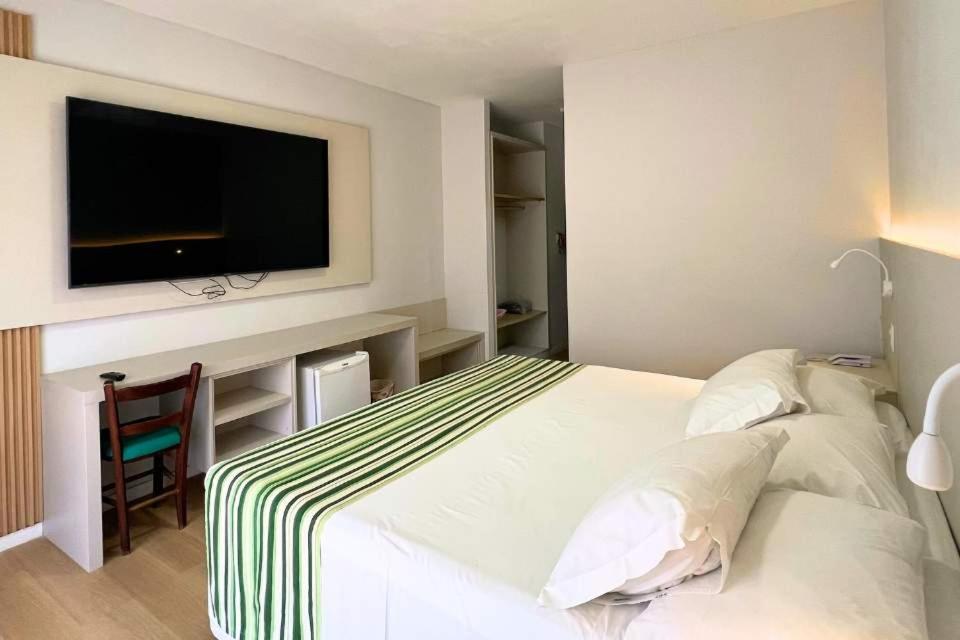 Postel nebo postele na pokoji v ubytování Resort Costa Dos Coqueiros