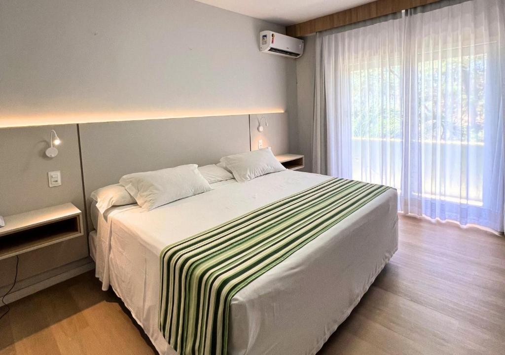 Postel nebo postele na pokoji v ubytování Resort Costa Dos Coqueiros