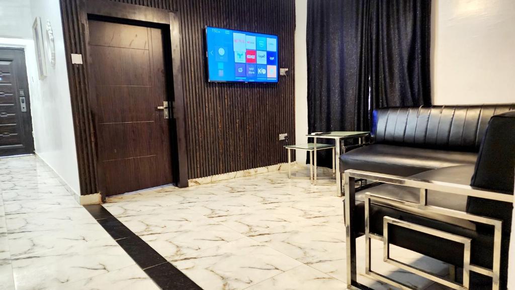 TV a/nebo společenská místnost v ubytování CG Apartments