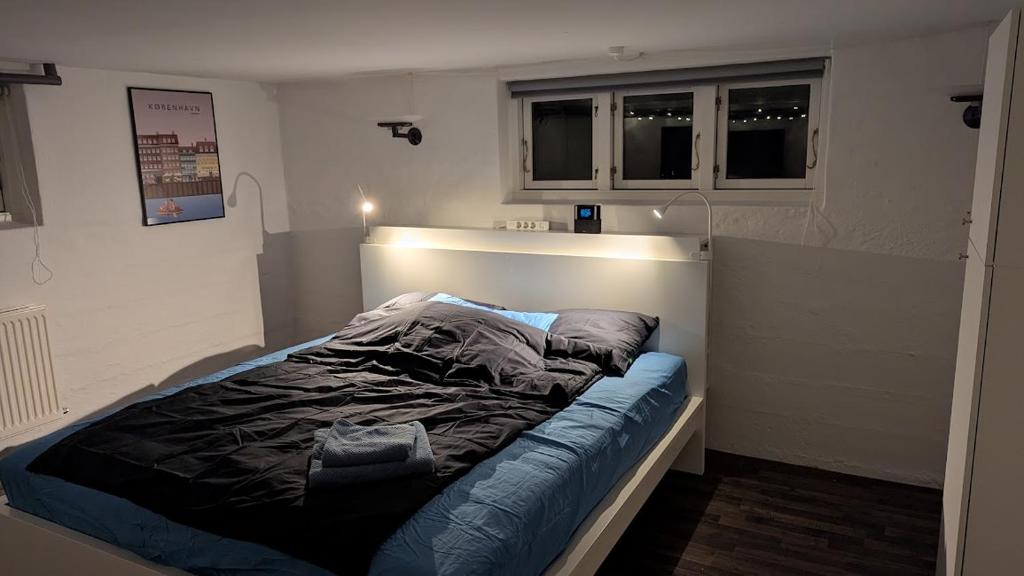 Postel nebo postele na pokoji v ubytování Sleep In Lynge