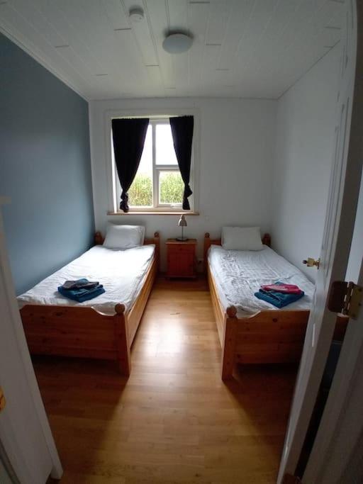 Postel nebo postele na pokoji v ubytování Hóll Guesthouse