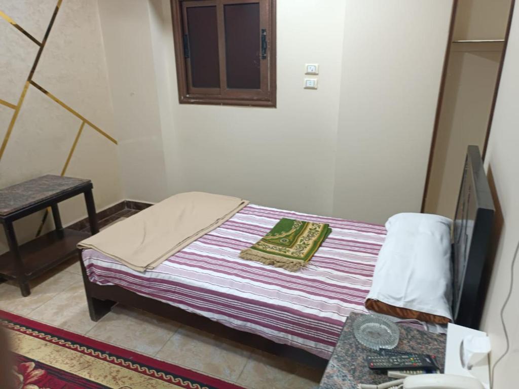 Postel nebo postele na pokoji v ubytování فندق الإيمان El Eman Hotel