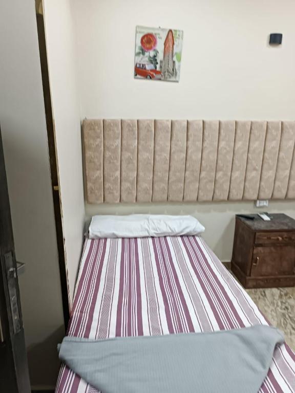 Postel nebo postele na pokoji v ubytování فندق الإيمان El Eman Hotel