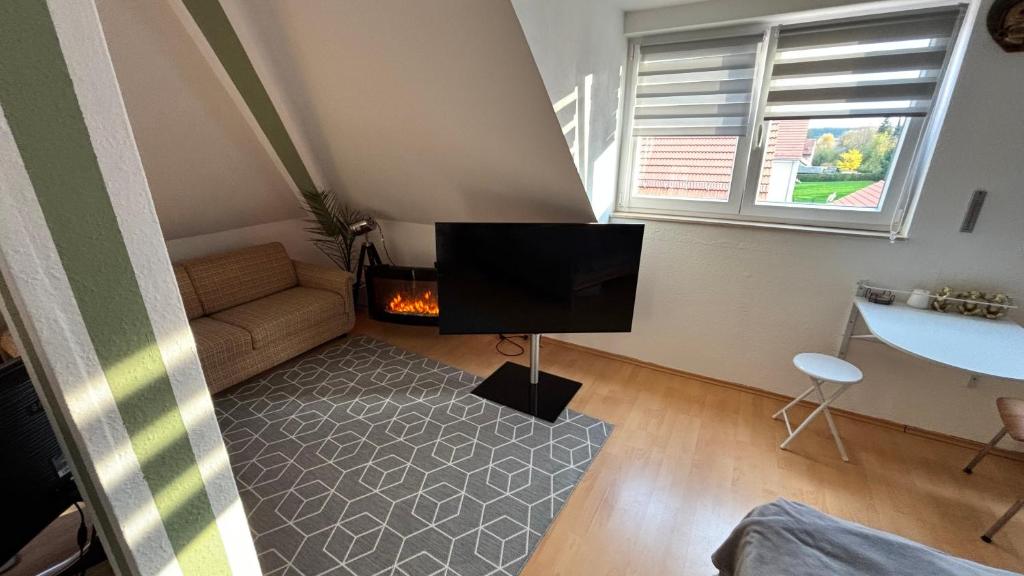 TV a/nebo společenská místnost v ubytování ModerneDG-Wohnung mit Homeoffice