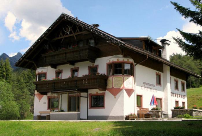 a large white building with a roof at Neunerhof in Leutasch
