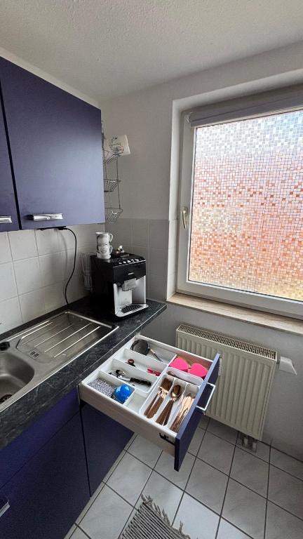 Kuchyň nebo kuchyňský kout v ubytování ModerneDG-Wohnung mit Homeoffice