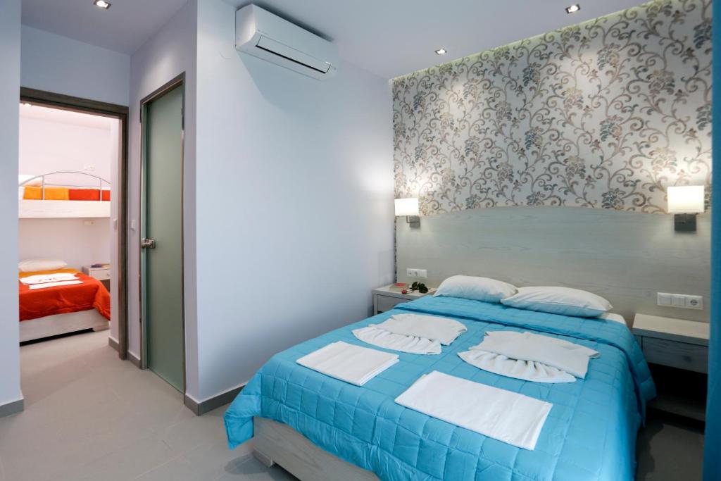 Postel nebo postele na pokoji v ubytování Hotel Akti