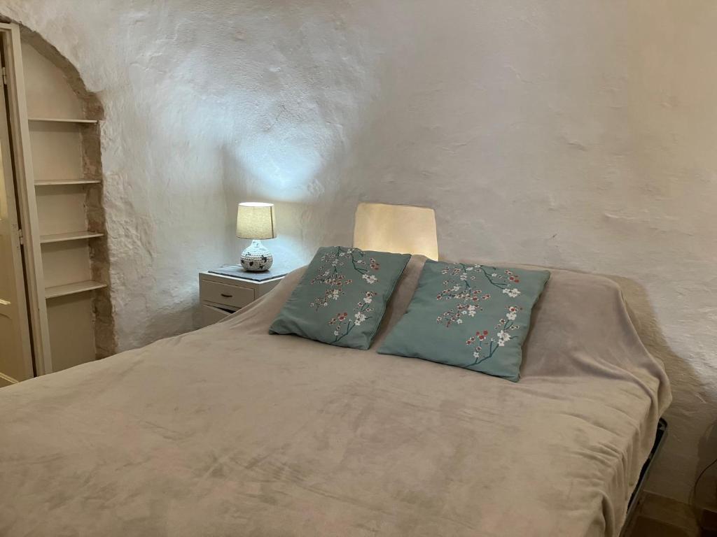 Postel nebo postele na pokoji v ubytování Trulli e Masseria Ianella