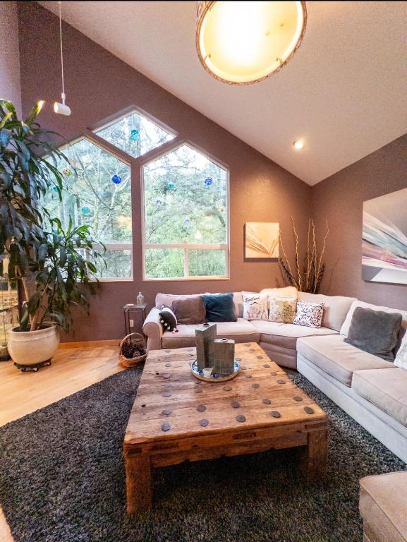 a living room with a couch and a coffee table at The Mountain House in Corvallis