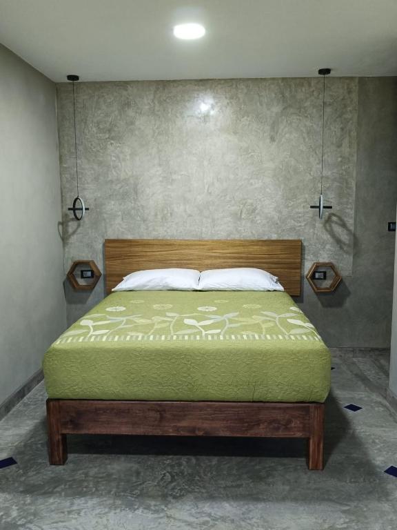 a bedroom with a bed in a room at Casa Lomas Grangelo in Atlixco