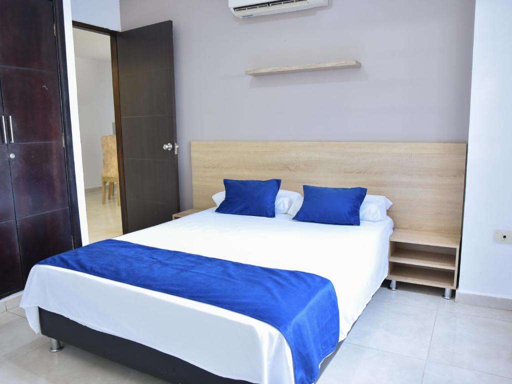 Postel nebo postele na pokoji v ubytování Hotel Iguaraya Inn