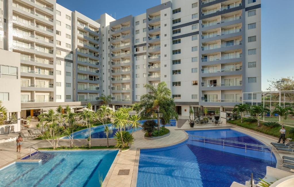 an image of an apartment complex with a swimming pool at Veredas - Rio Quente Temporada in Rio Quente