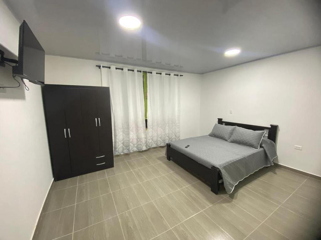 Voodi või voodid majutusasutuse Aparta hotel Brisas de salento toas