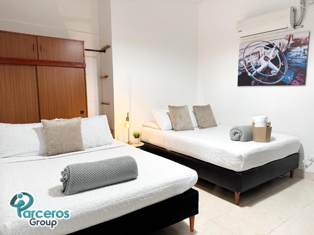 Postel nebo postele na pokoji v ubytování Apartamentos Amoblados En La Circunvalar Cerca a Parque Arboleda y Parque La Rebeca, Por Parceros Group