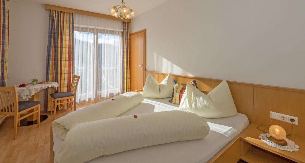 Postel nebo postele na pokoji v ubytování Haus Schluder - Familie Stanitzer