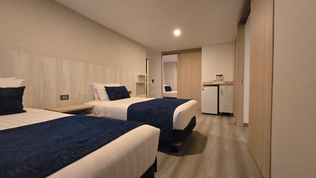 Postel nebo postele na pokoji v ubytování Hotel Confort 80 Zona Rosa