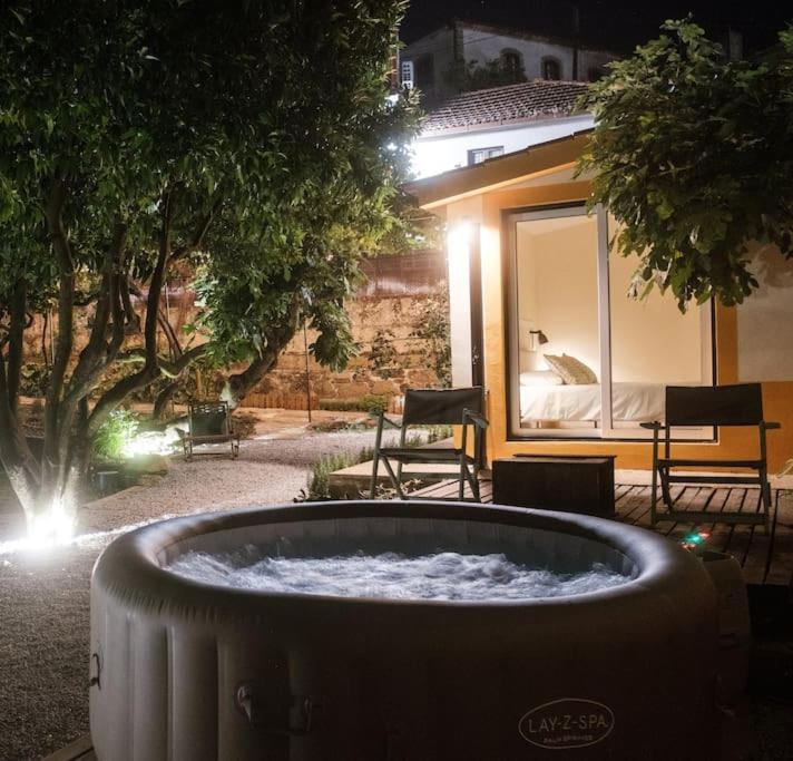 a large water fountain in front of a building at BABhouse Villa Jardim das Laranjeiras in Nagoselo do Douro