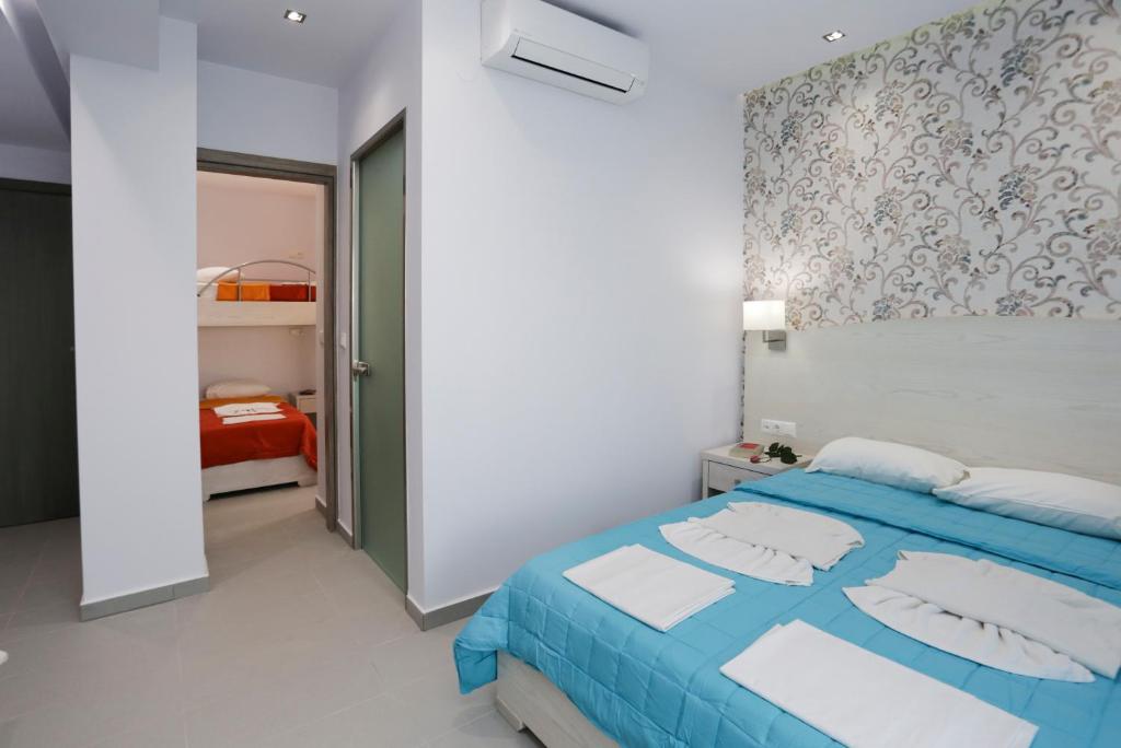 Postel nebo postele na pokoji v ubytování Hotel Akti