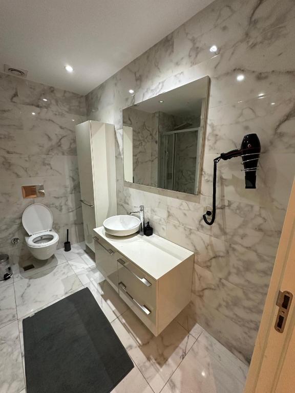 A bathroom at Ottomare Suites luxury apartment with pool with amazing view