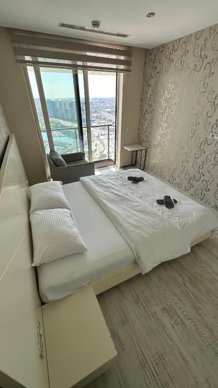 A bed or beds in a room at Ottomare Suites luxury apartment with pool with amazing view