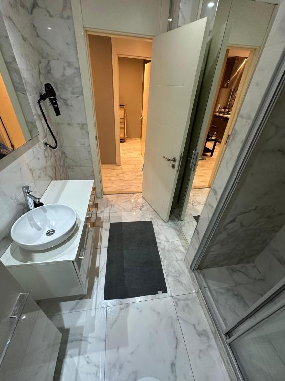 A bathroom at Ottomare Suites luxury apartment with pool with amazing view