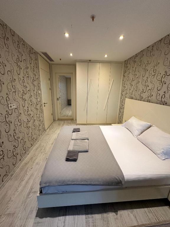 A bed or beds in a room at Ottomare Suites luxury apartment with pool with amazing view