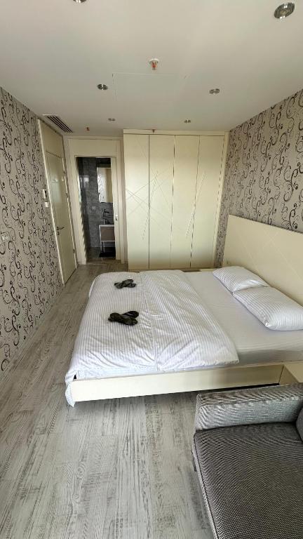 A bed or beds in a room at Ottomare Suites luxury apartment with pool with amazing view