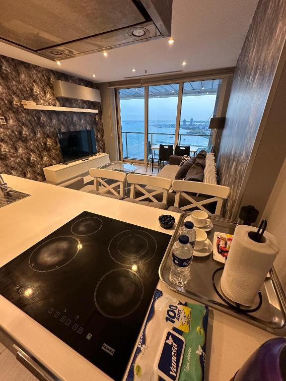 A kitchen or kitchenette at Ottomare Suites luxury apartment with pool with amazing view