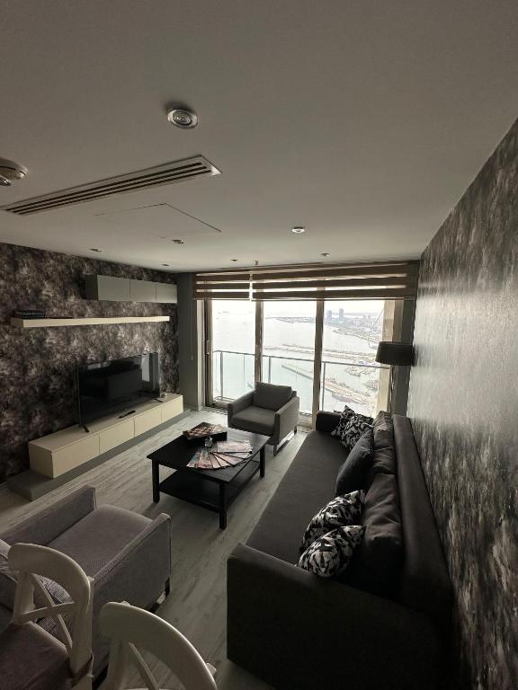 A seating area at Ottomare Suites luxury apartment with pool with amazing view