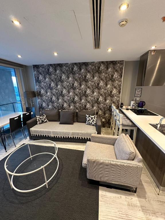 A seating area at Ottomare Suites luxury apartment with pool with amazing view