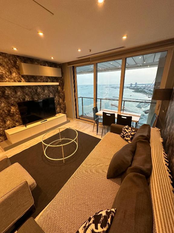 A seating area at Ottomare Suites luxury apartment with pool with amazing view