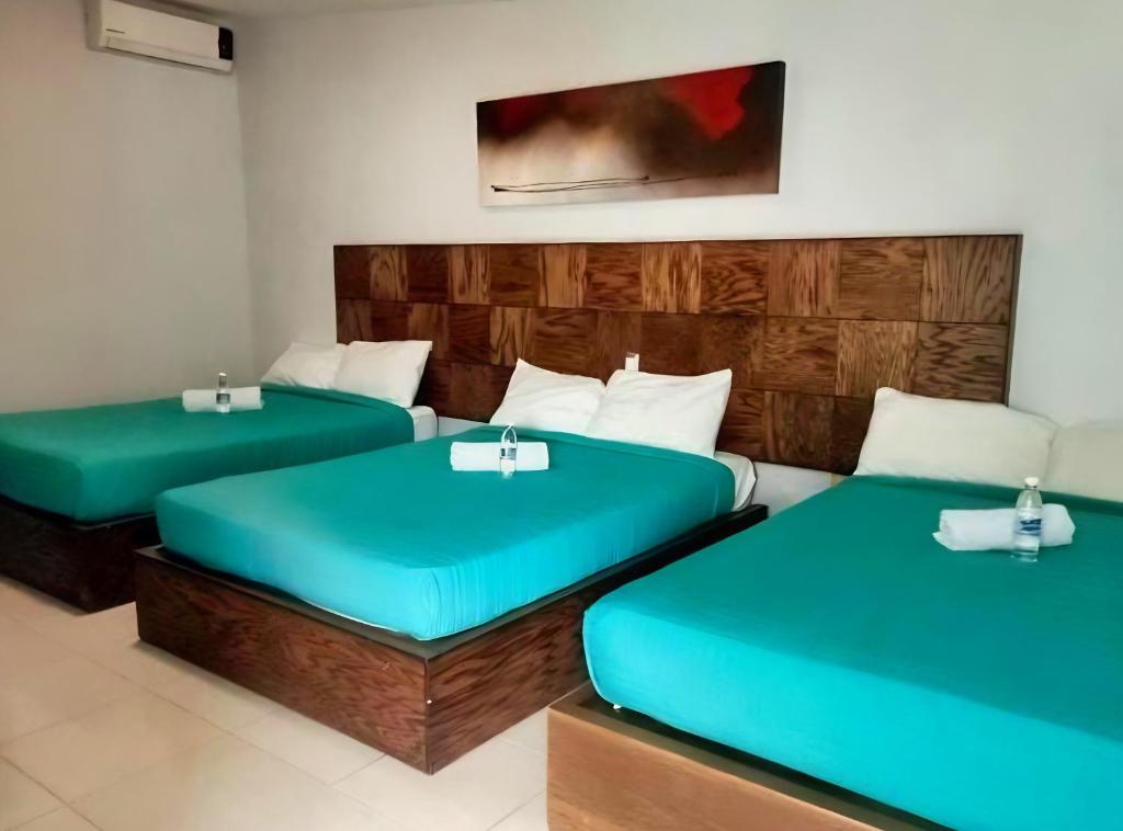 Postel nebo postele na pokoji v ubytování Hotel JM