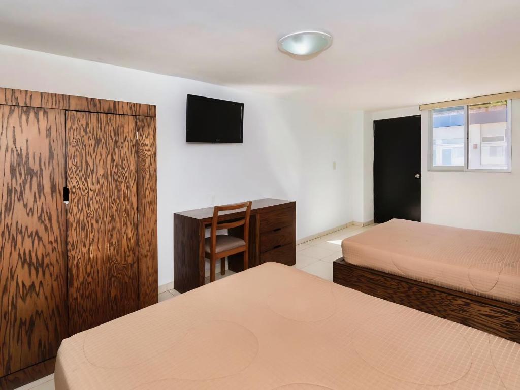 Postel nebo postele na pokoji v ubytování Hotel JM