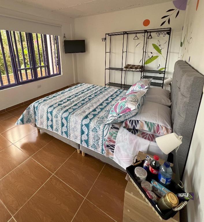 Postel nebo postele na pokoji v ubytování NUEVO Hotel Morada en el centro del Eje Cafetero