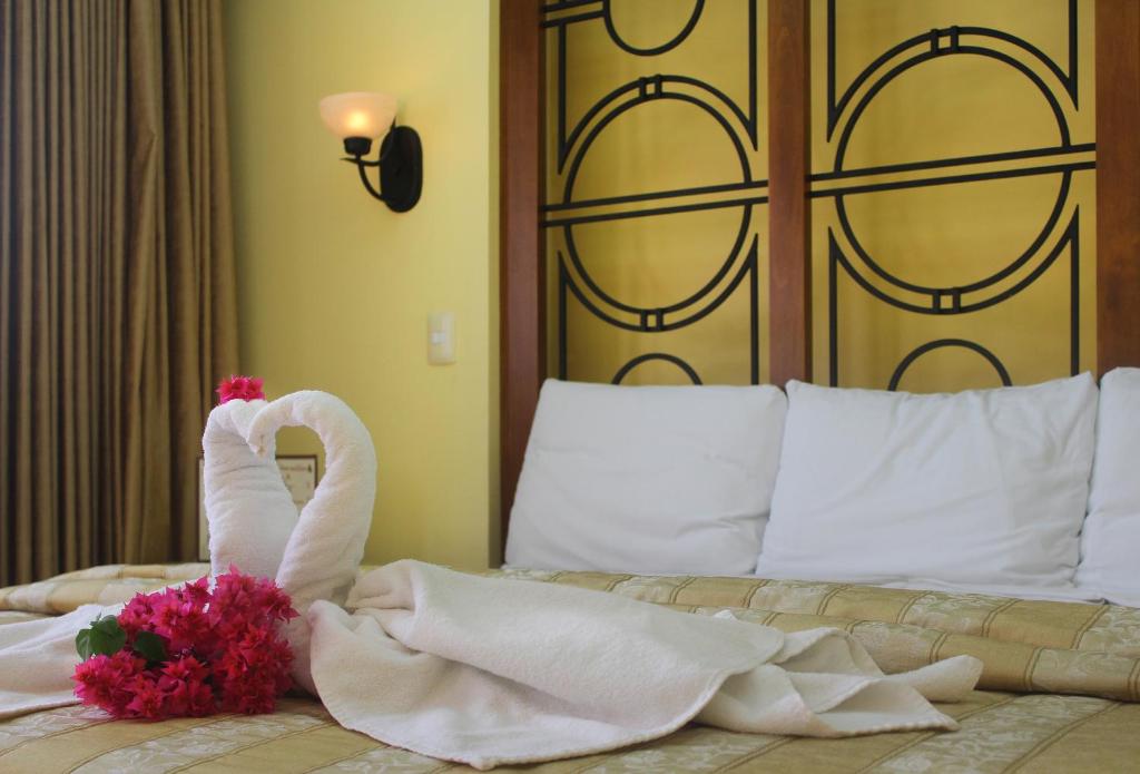 Postel nebo postele na pokoji v ubytování Hotel Residencial