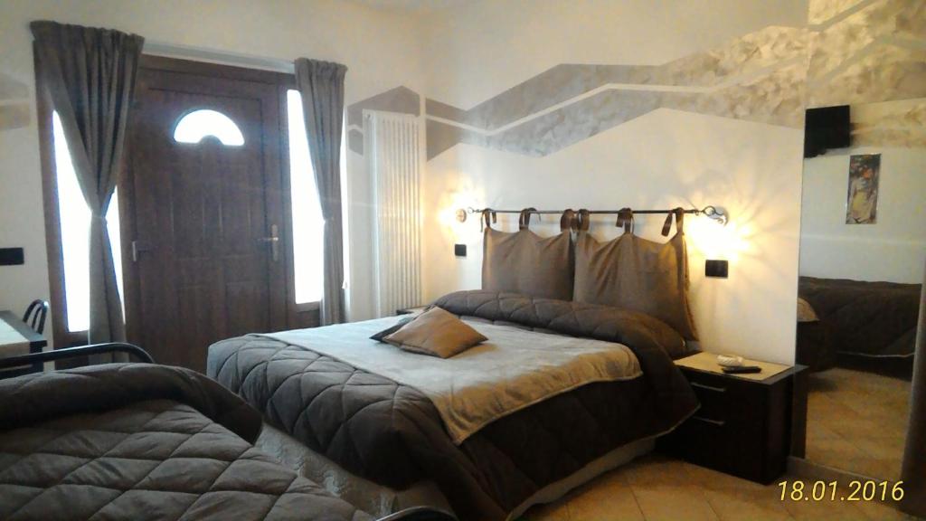 Tempat tidur dalam kamar di La Casa Del Grillo 1